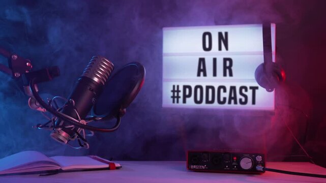 Professional Podcast Recording Setup with Microphone and Headphones and a sign that reads on air podcast
