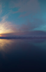 Obraz premium Tranquil Sunset Over Calm Ocean With Mountain Silhouette And Dramatic Sky Reflection — 3D Rendering