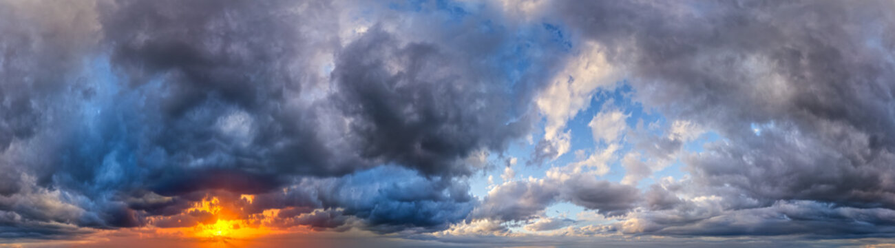 Dramatic Sunset With Storm Clouds Over Ocean Panorama, Moody Sky at Golden Hour