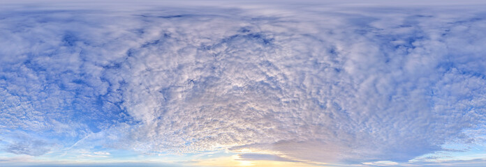 Obraz premium Panoramic Cloudscape Over Blue Sky With Textured Altocumulus Clouds At Sunrise Horizon