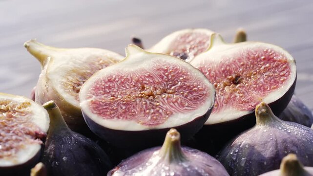 Whole Delicate Fresh Ripe Figs With Flowers and Water Drops. Ficus Carica. Side View. Healthy Aesthetic Food Styling.