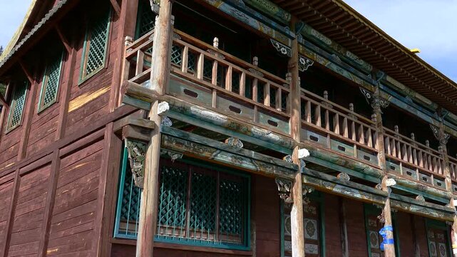 A small wooden two-story Buddhist temple at the foot of a rocky mountain.
   The monastery of Manjushri is 40 km from Ulaanbaatar.