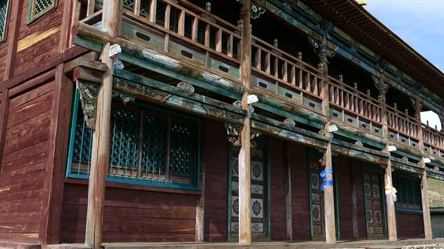 A small wooden two-story Buddhist temple in a mountainous wooded area.
   The monastery of Manjushri is 40 km from Ulan Bator.