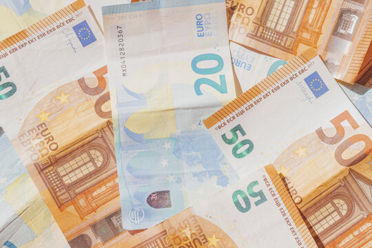 Twenty and fifty euro banknotes as flat lay pattern. Top view photo European paper money