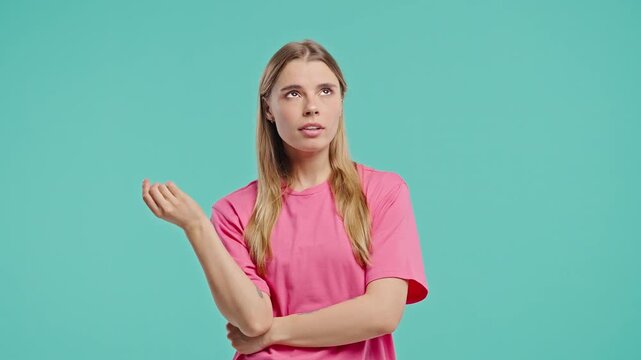 Young Blonde Woman Rolls Eyes, Makes Blah Gesture,Bored Facial Expression