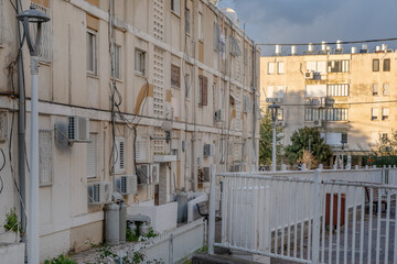 Aged multi-story residential apartment building from the 1970s in Israel