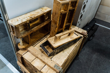 Obraz premium Wooden Storage Units. Roughsawn Wooden Pallets Used In Workshop Storage Solutions. Containers Of Aged And Roughhewn Wood Employed For Display And Industrial Storage Functions