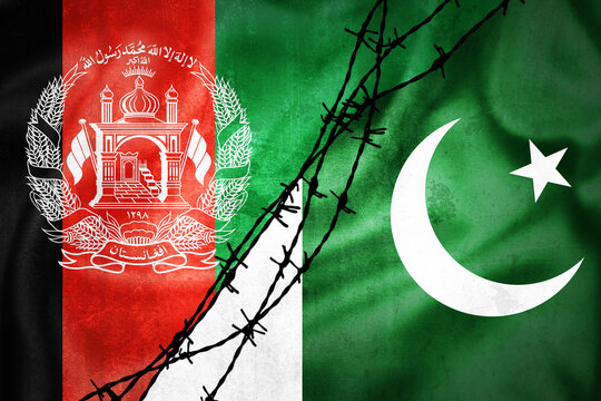 Grunge flags of Afghanistan and Pakistan divided by barb wire illustration