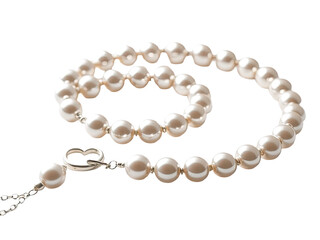 A close-up shot of a beautiful white pearl necklace featuring a simple silver clasp