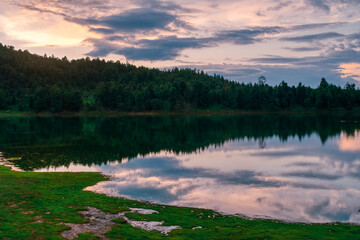 Fototapeta premium A lake with a beautiful sunset in the background