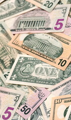 United States dollars money bills pile on table. USA banknotes of USD currency close up.