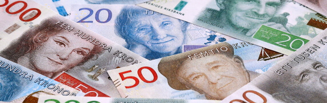 Swedish krona money bills pile on table. Sweden banknotes of SEK currency close up.
