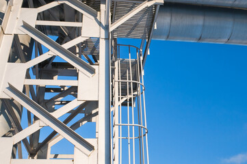 pipeline and metal support against the blue sky