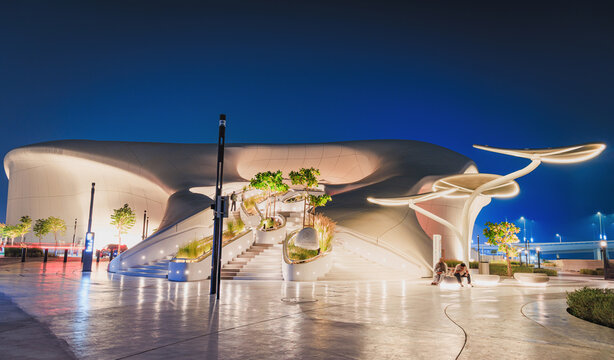 6 December 2025, Abu Dhabi, UAE: TeamLab Museum presenting innovative architecture with curved forms, illuminated stairs, and organic landscaping at night