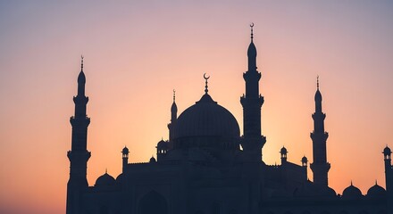 Silhouette of a majestic mosque with multiple minarets and a large dome at dusk from a frontal viewpoint