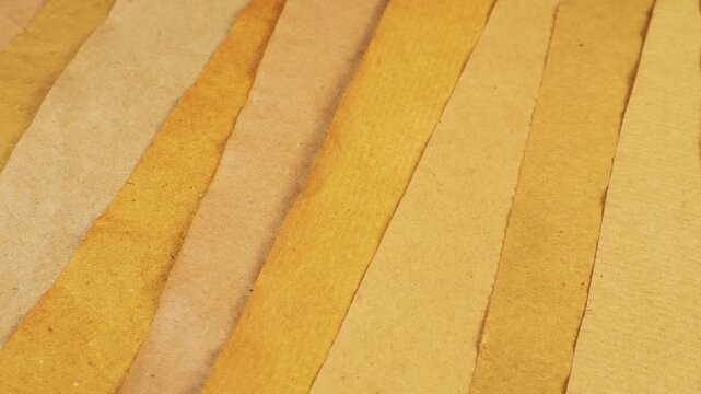 Handmade craft paper texture with natural coloring matter in shades of yellow and beige. Eco recycled material background for junk journal and creative scrapbooking.