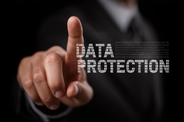 A hand points at "DATA PROTECTION" text with binary code overlay.