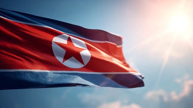north korean flag waving in blue sky. flag of north korea