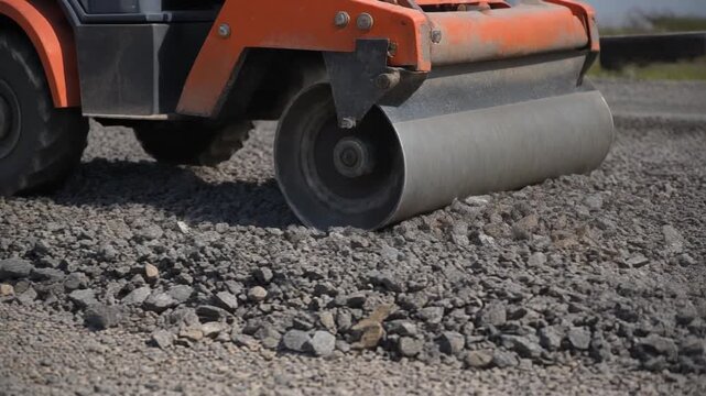 Road Roller Compacting Gravel Surface.