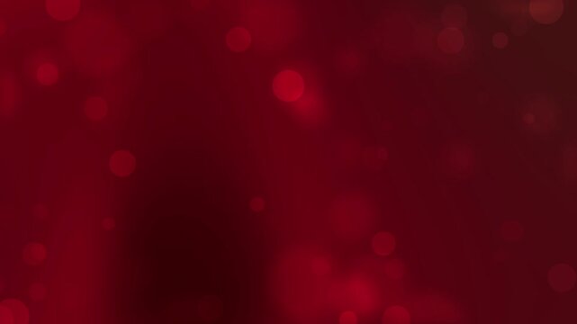 Blurry red bokeh lights create a festive atmosphere perfect for backgrounds, holiday designs, christmas themes, and abstract concepts.