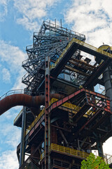 Immaculate Metal Construction Illustrating Walkways And Protective Measures Beneath Overcast Sky