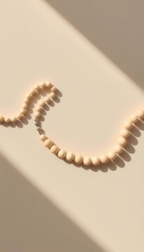 minimal tasbih prayer beads with soft light shadow background 