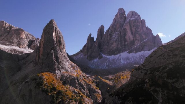 Drone rising above Croda dei Toni peak in Dolomites, Italy