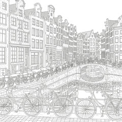 Fototapeta premium Detailed black and white illustration of bicycles parked on a cobblestone street in front of a bridge and traditional European buildings.