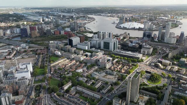 Aerial view over Poplar, East London, showing the Canary Wharf skyline, River Thames, Leamouth peninsula, and The O2 in North Greenwich.