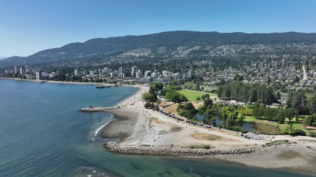 Drone Flying Down Toward Ambleside Beach in West Vancouver, British Columbia Canada