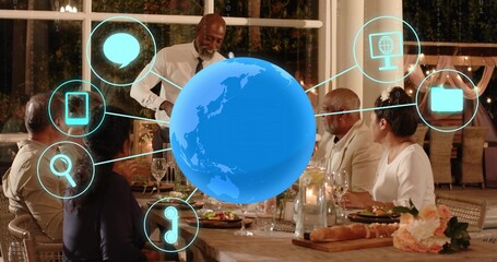 Hovering blue hologram globe above wooden table at home, linking cyan UI icons, server wearing tie © vectorfusionart