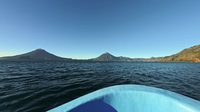 Panajachel, Guatemala, panoramic view of Lake Atitlan at sunrise while sailing