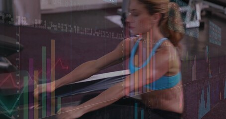 Rowing mid-adult woman powering stroke at gym on rower with data charts overlay, wearing blue bra © vectorfusionart