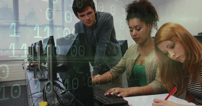Man leaning over desk guiding user typing right user noting binary overlaying screens in tech lab
