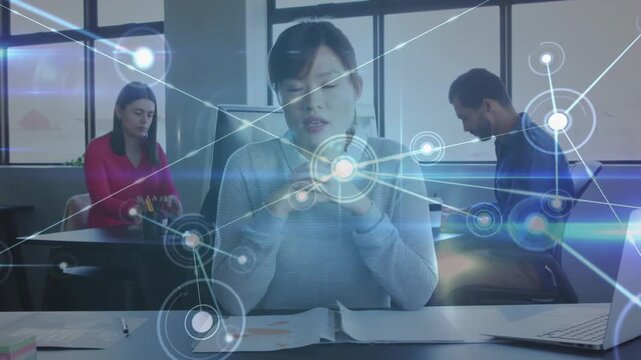 Center desk woman sorting charts holding node starting overlay filling frame showing business data
