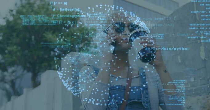 Woman using binoculars by fence bringing globe code overlay switching to phone with coffee for tech