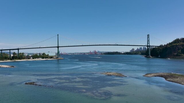 Drone Rising Above Burrard Inlet Revealing Lions Gate Bridge, Vancouver British Columbia Canada
