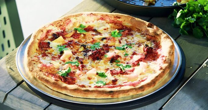 Delicious pizza being cut up with roller - closeup, high shot
