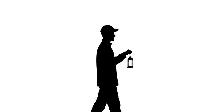 Silhouette of a man walking with a lantern in hand.