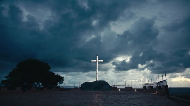 A radiant white cross standing atop a rock in the darkness, glowing powerfully beneath dramatic storm clouds. The deep blue sky and rolling shadows amplify the contrast, epic and symbolic