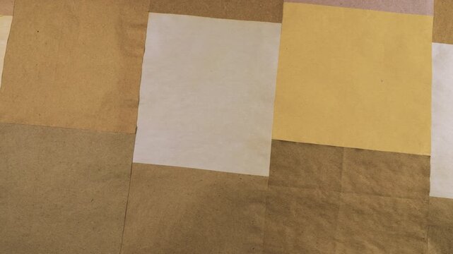 Handmade yellow and white craft paper background featuring natural vegetable dye textures. This eco recycled material creates a unique grunge background for scrapbooking and junk journals.