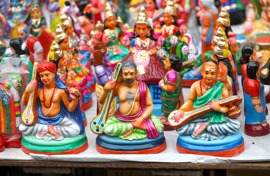 Trinity of Carnatic Music Thyagaraja, Muthuswami Dikshitar and Syama Sastri idols are displayed for sale in a shop for the golu festival	
