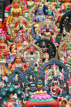 Hindu God and Goddess idols are displayed for sale in a shop for the Golu festival