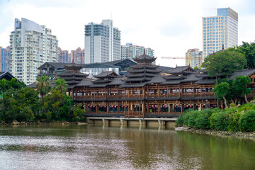 Ancient ethnic architecture of Fengyu Bridge at Folk Song Lake in Nanning, Guangxi, China © Steve