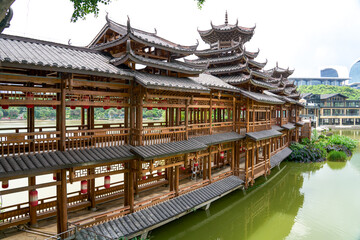 Ancient ethnic architecture of Fengyu Bridge at Folk Song Lake in Nanning, Guangxi, China © Steve