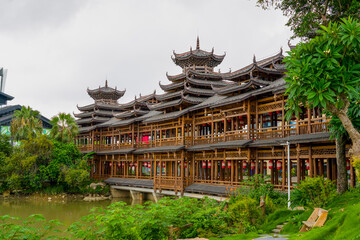 Ancient ethnic architecture of Fengyu Bridge at Folk Song Lake in Nanning, Guangxi, China © Steve