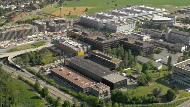 Aerial view of a modern business park with ongoing construction and established buildings