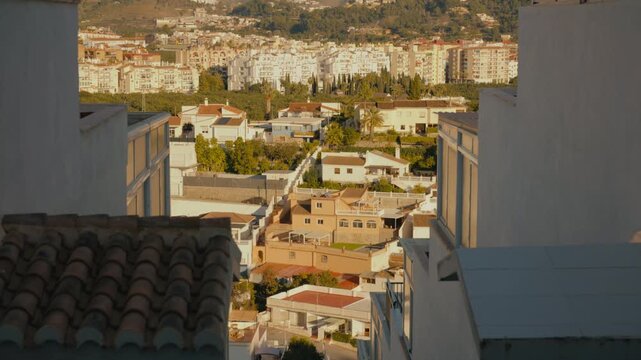 Traditional white stairway with blue details descending through an Andalusian neighborhood in Almu&ntilde;&eacute;car, southern Spain.