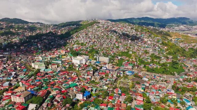 Cinematic drone establishing shot Baguio Benguet Philippines sunny cloudy day
