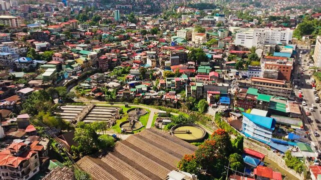 Baguio Benguet Philippines sunny drone tilt reveals city water treatment plant